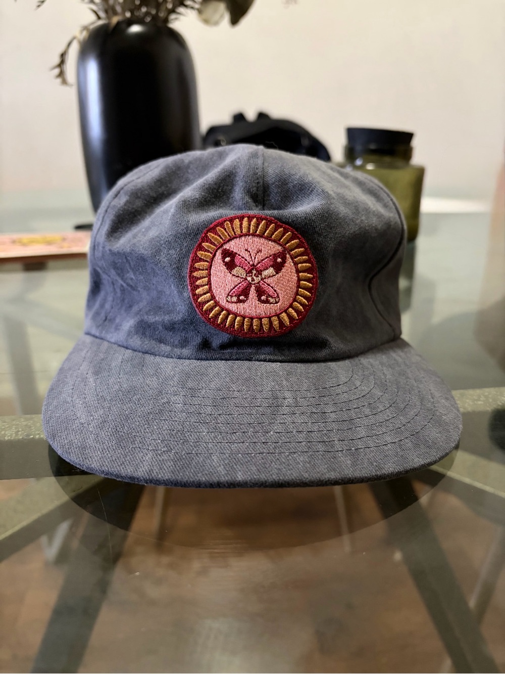 Washed Navy Cotton Weld Mfg. cap w/Embroidered Butterfly lady patch.Never worn.